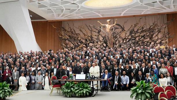 Pope Francis poses for a picture with participants of the Synod of Bishops 16th General Assembly in the Paul VI Hall at the Vatican, Oct. 23, 2023. (AP Photo/Gregorio Borgia)