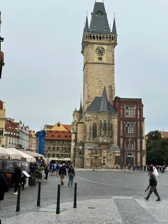 A large stone building with a clock tower

AI-generated content may be incorrect.