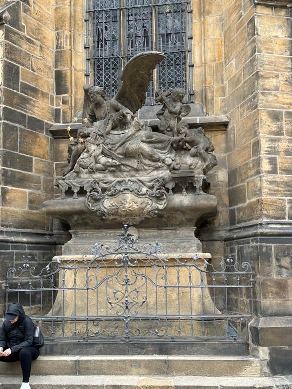 A statue of a winged angel in front of a stone building

AI-generated content may be incorrect.